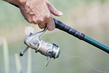Fisherman Hand Holding A Fishing Rod Royalty Free Stock Photography Fisherman Hand Holding A Fishing Rod Royalty Free Stock Photography