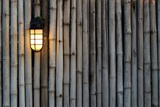 Yellow Lamp On The Bamboo Fence Royalty Free Stock Photography Yellow Lamp On The Bamboo Fence Royalty Free Stock Photography