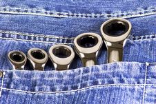 Blue Jeans Pocket With Wrenches Royalty Free Stock Photos