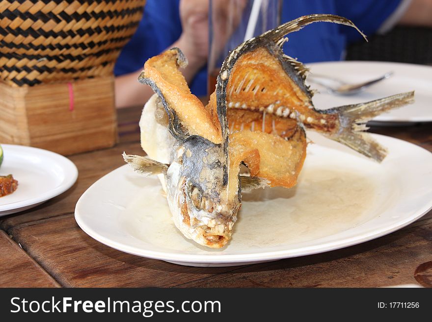 A baked fish on a plate