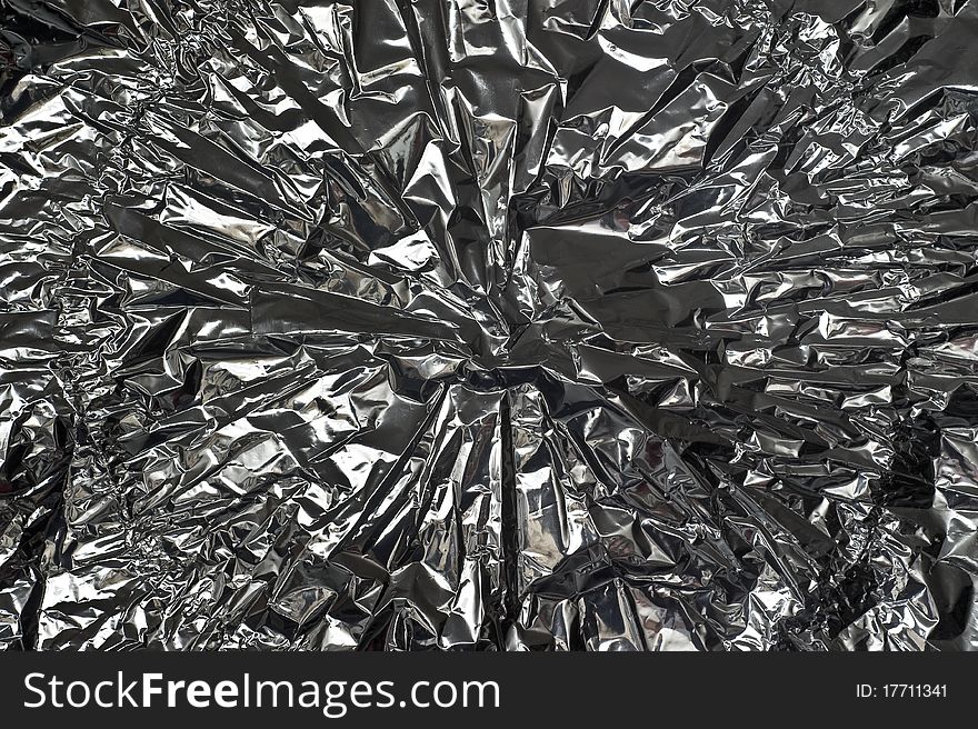 Close-up image of silver, crinkled metal foil. Close-up image of silver, crinkled metal foil