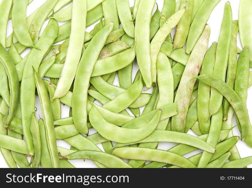 Green beans in the form of a white background