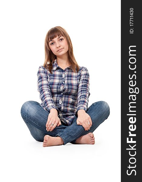 Young beautiful girl sits in pose lotos on white background