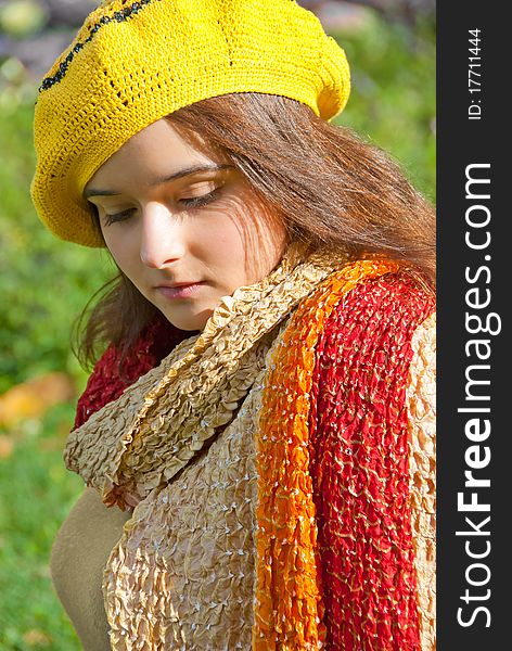 Portrait of a young beautiful woman on an autumn nature