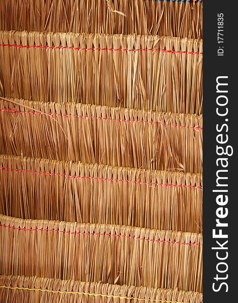 Texture of roof made from grass inside of temple hall in Thailand