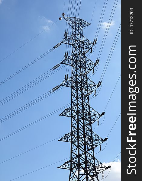 Electrical transmission towers carrying high voltage lines. Electrical transmission towers carrying high voltage lines.