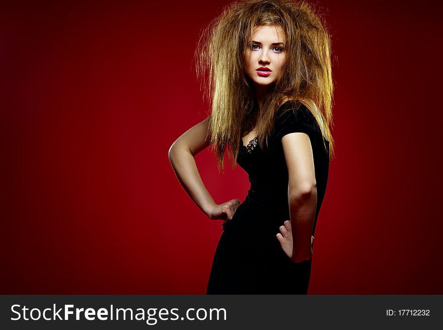Portrait of the beautiful girl with a mad hairdres