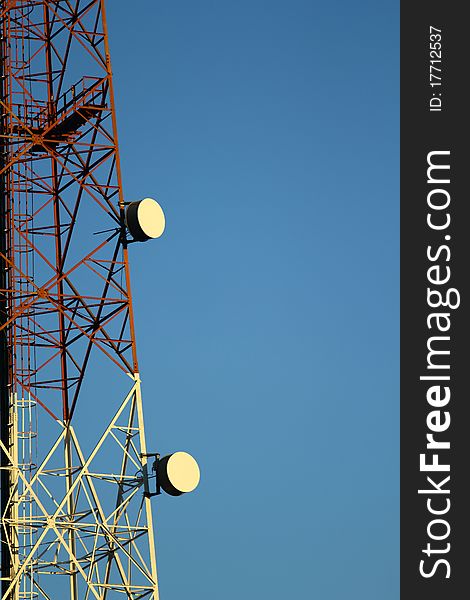 Antenna on blue cloud sky