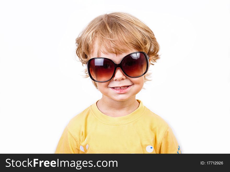 The joyful little boy with solar points on a white background