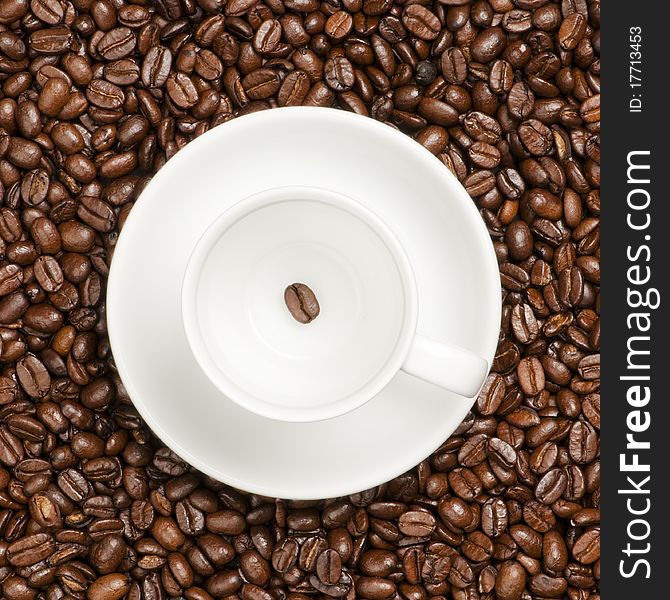 White coffee cup with plate and coffee beans. White coffee cup with plate and coffee beans.