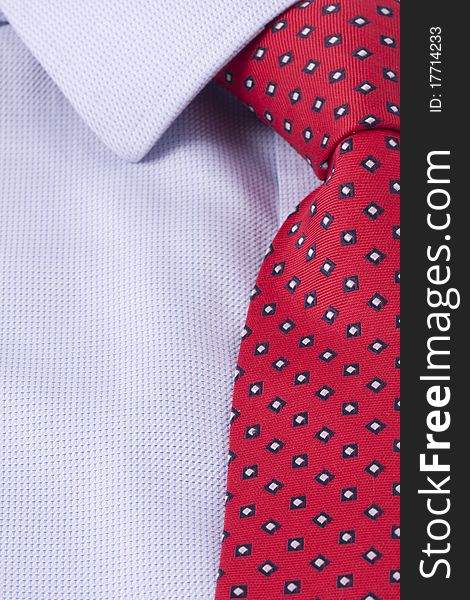 Close up of a red business tie and a blue dress shirt. Close up of a red business tie and a blue dress shirt