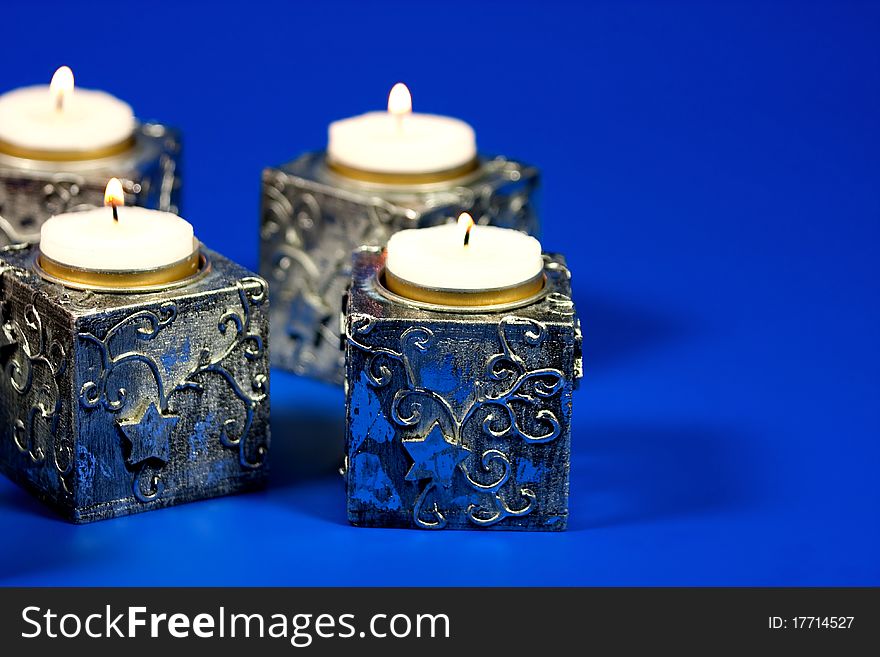 Christmas candle over blue background