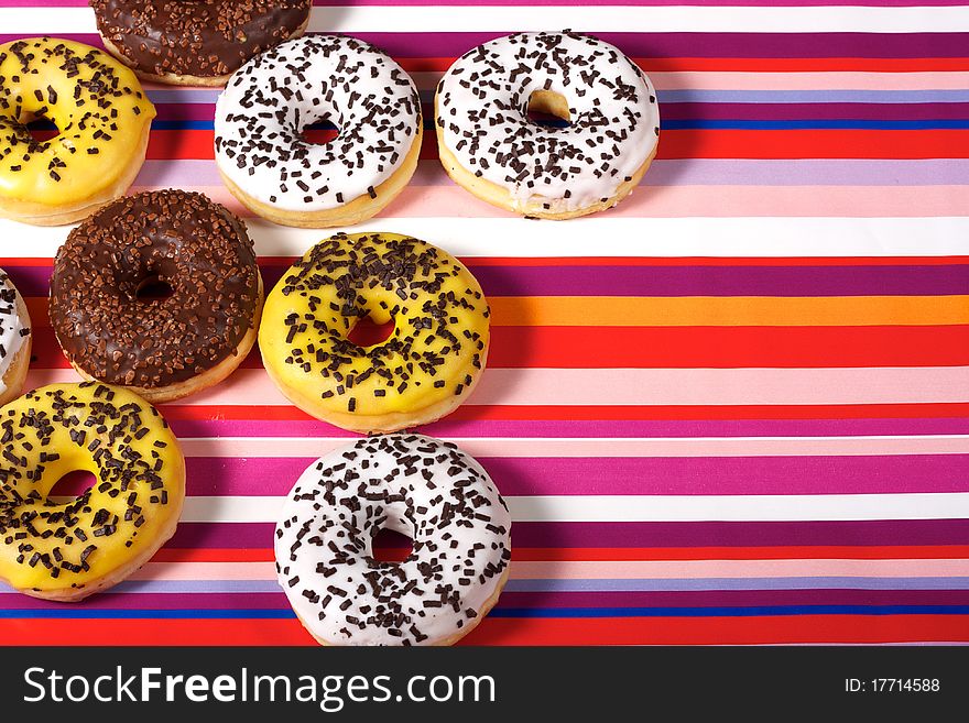 Sweet Donuts on red tablecloth