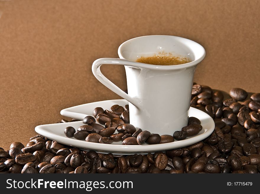 A creamy espresso with a coffee bean