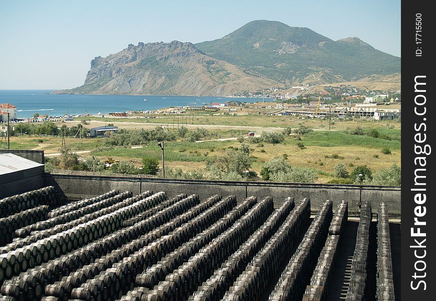 Wine barrels are located in a number of mountains in the background