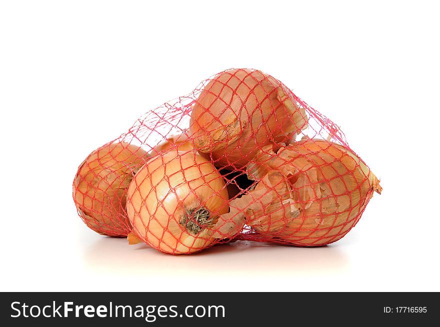 Onions in a net isolated on white