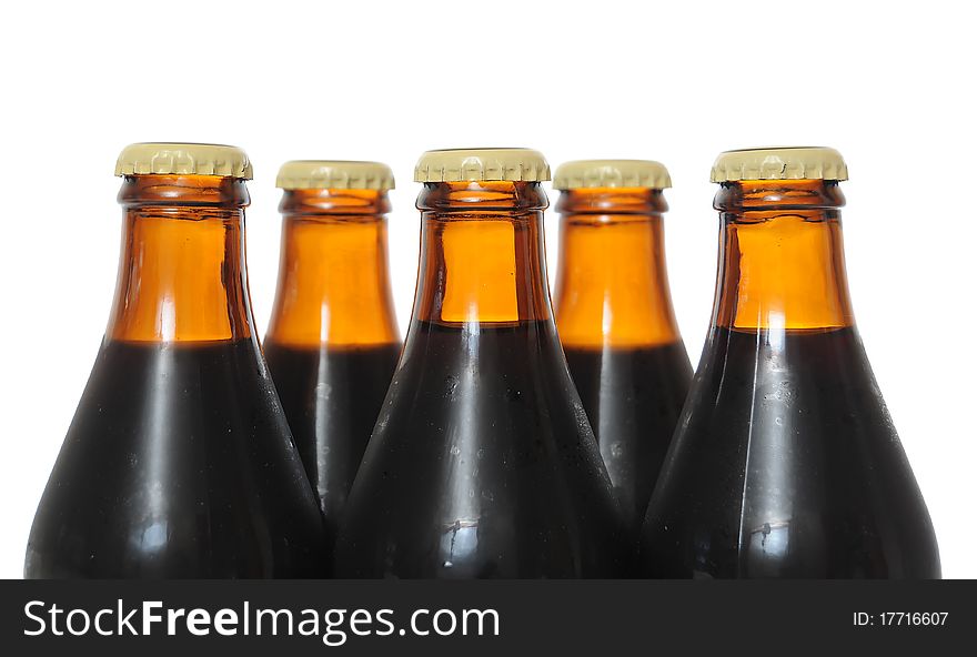 Dark beer bottles isolated on white background