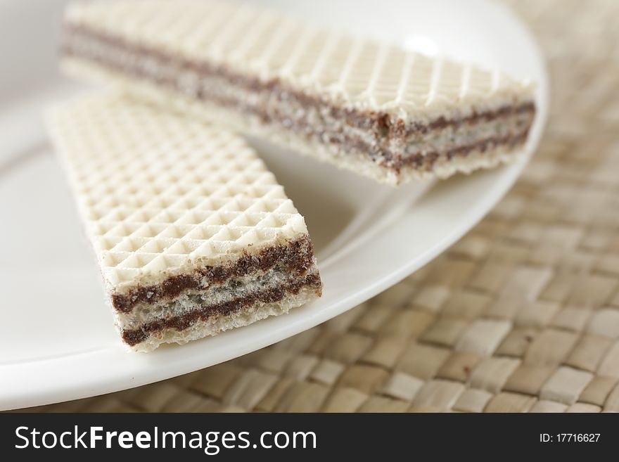 Chocolate-cream sandwich on a white plate. Chocolate-cream sandwich on a white plate