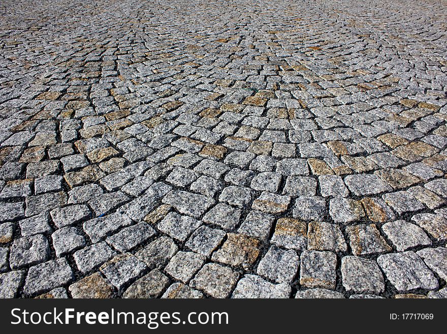 Background of the gray paving stones arranged in a circle. Background of the gray paving stones arranged in a circle