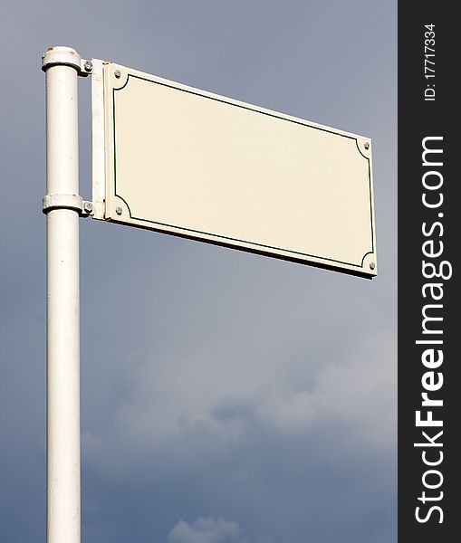 Empty street sign with cloudy background