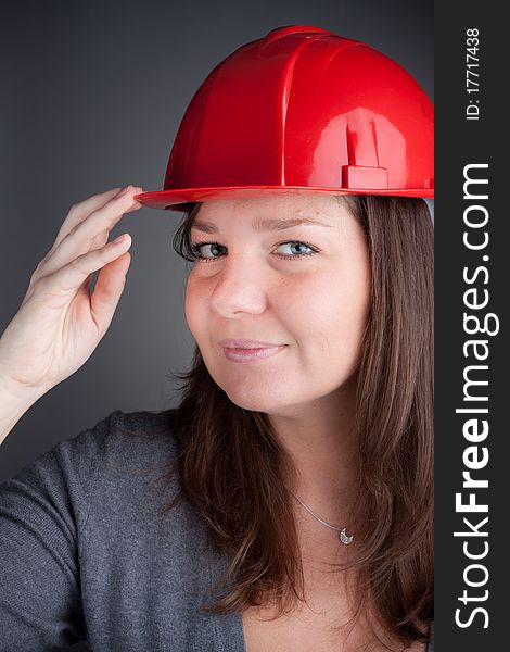 Young architect women wearing red hardhat