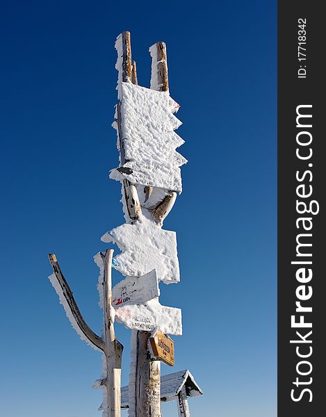 Signpost in the mountains during the winter