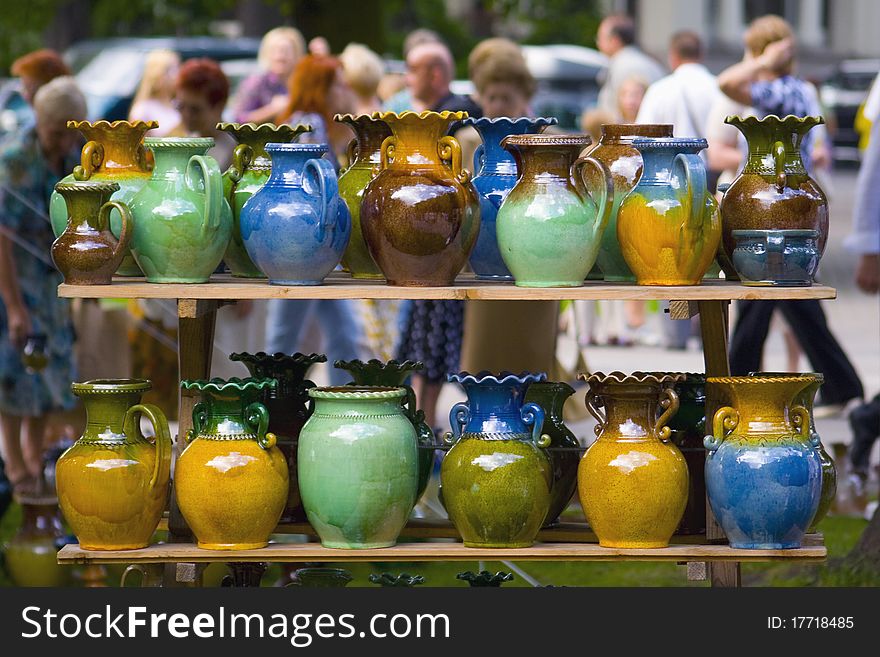 Colorful clay mugs for sale in a local summer fair. Riga, Latvia. Colorful clay mugs for sale in a local summer fair. Riga, Latvia.