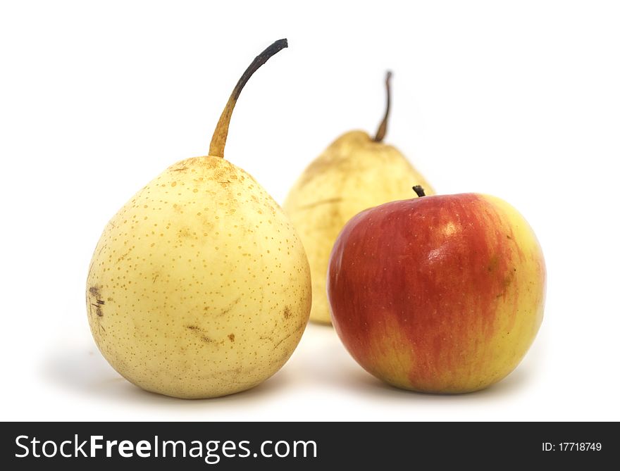 Apple and two pears isolated on the white. Apple and two pears isolated on the white