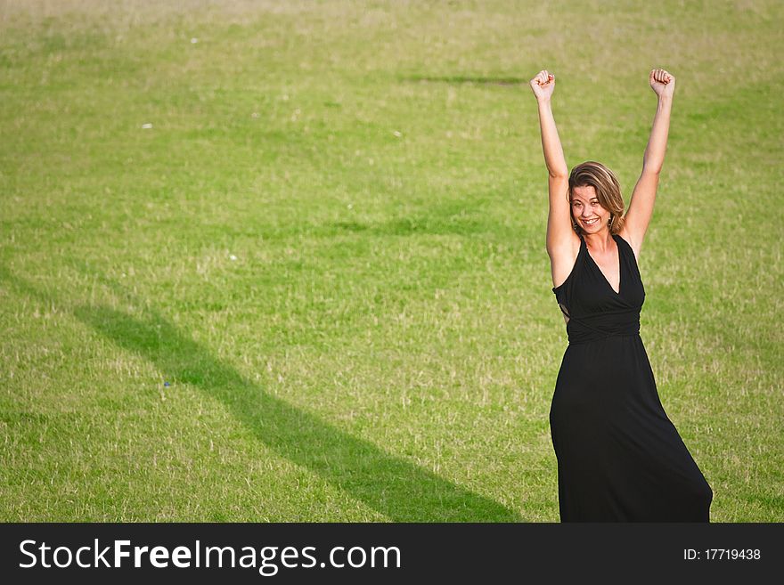 Young girl with hands in the air