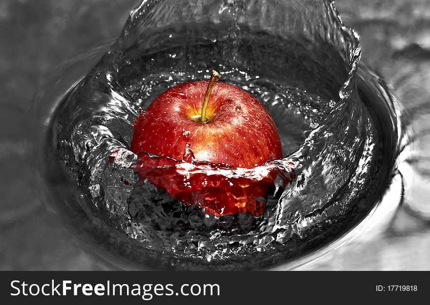 Red Apple in water with splashes. Red Apple in water with splashes