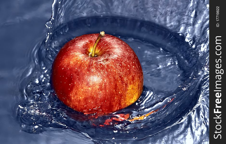 Red Apple in water with splash. Red Apple in water with splash
