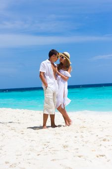 Happy Young Couple On A Beach Stock Images