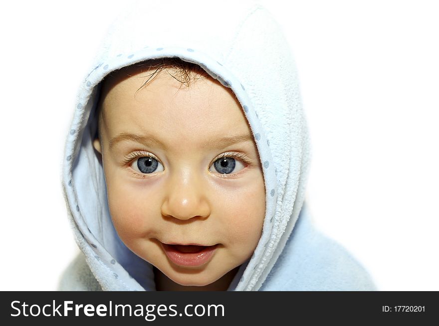 Portrait a baby in a bathrobe after bath. Portrait a baby in a bathrobe after bath