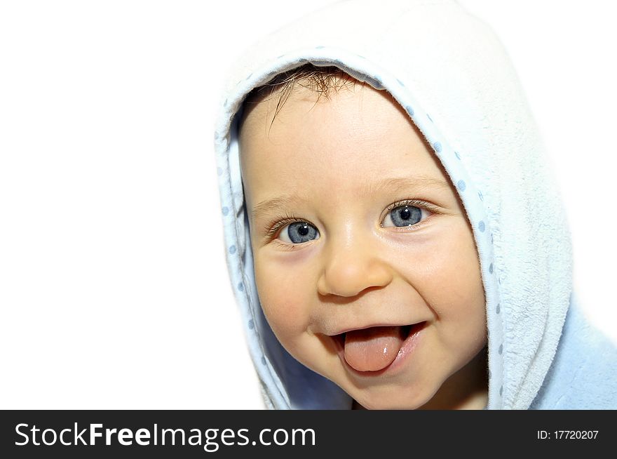 Portrait a baby in a bathrobe after bath. Portrait a baby in a bathrobe after bath