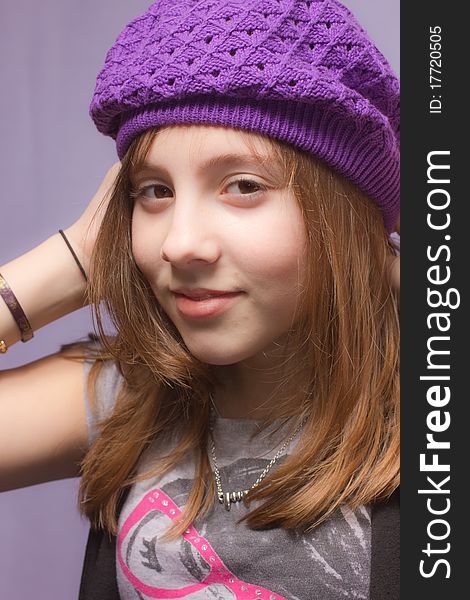 A girl wearing a purple hat. A girl wearing a purple hat