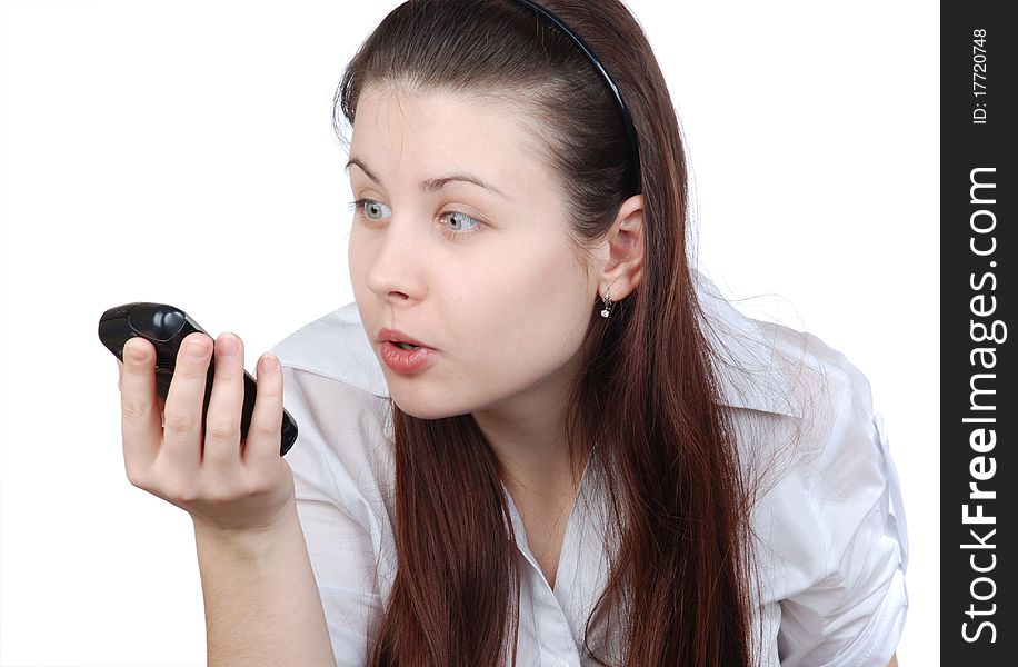 The woman with a cellular telephone on white a background