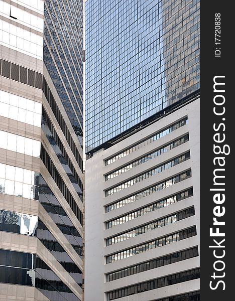 Modern buildings composition as line and block, geometric and space, with glass external and reflection, shown as city or urban environment and business concept. Modern buildings composition as line and block, geometric and space, with glass external and reflection, shown as city or urban environment and business concept.