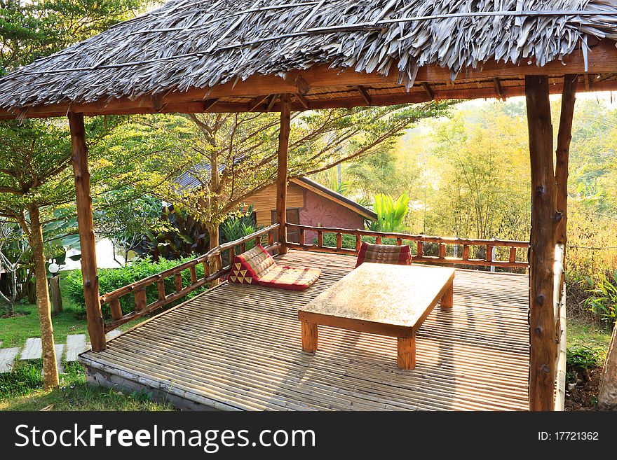 Peaceful relaxing in pavilion sitting among forest, Thailand