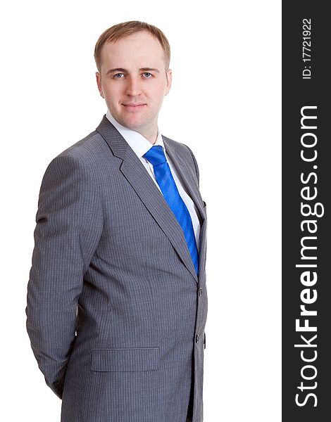 Portrait of a businessman in a gray suit and blue tie