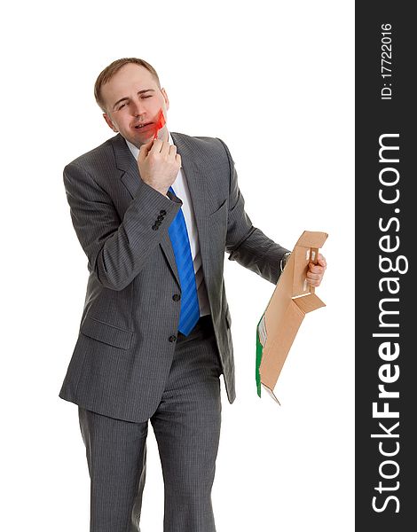 Businessman separates the red tape from his mouth