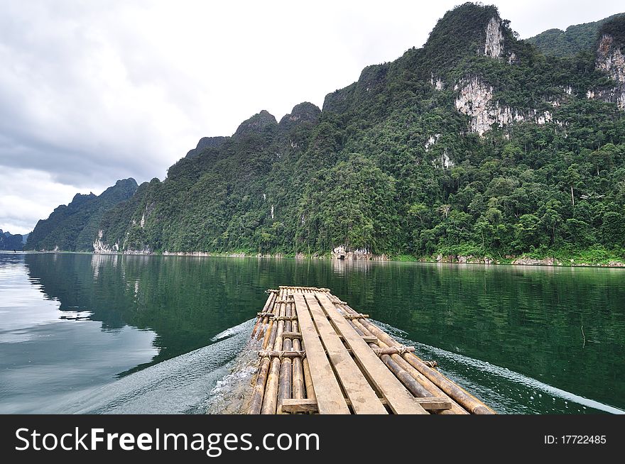 Bamboo raft heading on lake