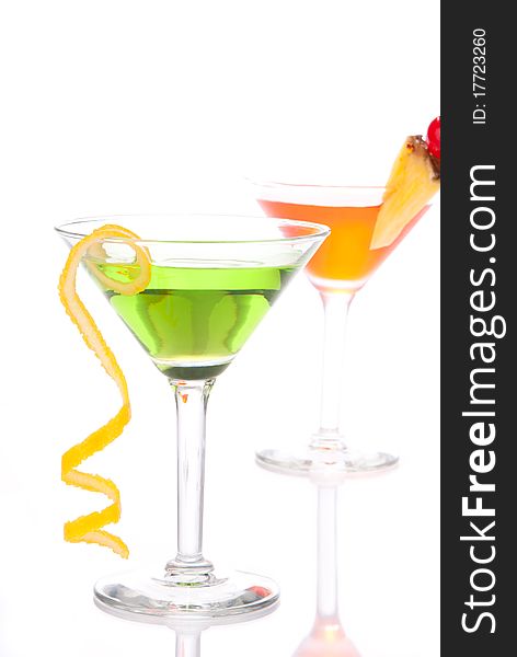 Green Red cocktails composition with vodka, light rum, gin, tequila, blue curacao, lime juice, lemonade, lemon slice, maraschino cherry isolated on a white background