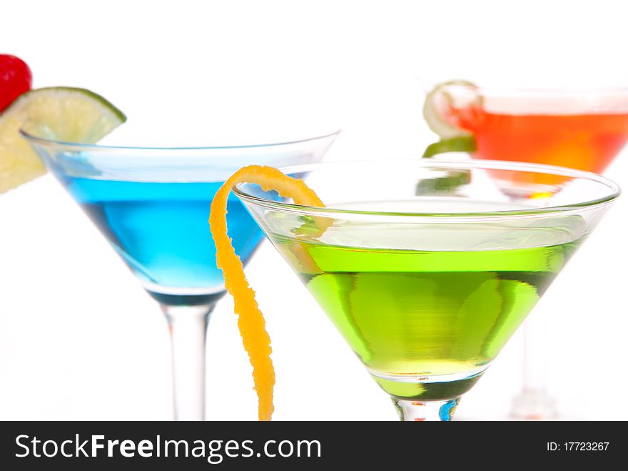 Tropical citrus martini Cocktails with vodka, light rum, gin, tequila, blue curacao, lime juice, lemonade, lemon slice, maraschino cherry isolated on a white background. Tropical citrus martini Cocktails with vodka, light rum, gin, tequila, blue curacao, lime juice, lemonade, lemon slice, maraschino cherry isolated on a white background