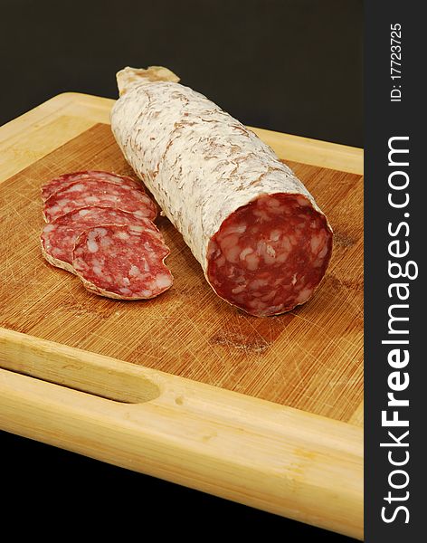 A whole ready to be sliced salami. A whole ready to be sliced salami