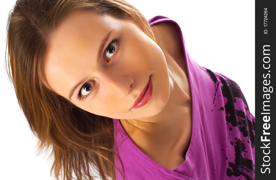 Young girl looking on camera from bottom on white background