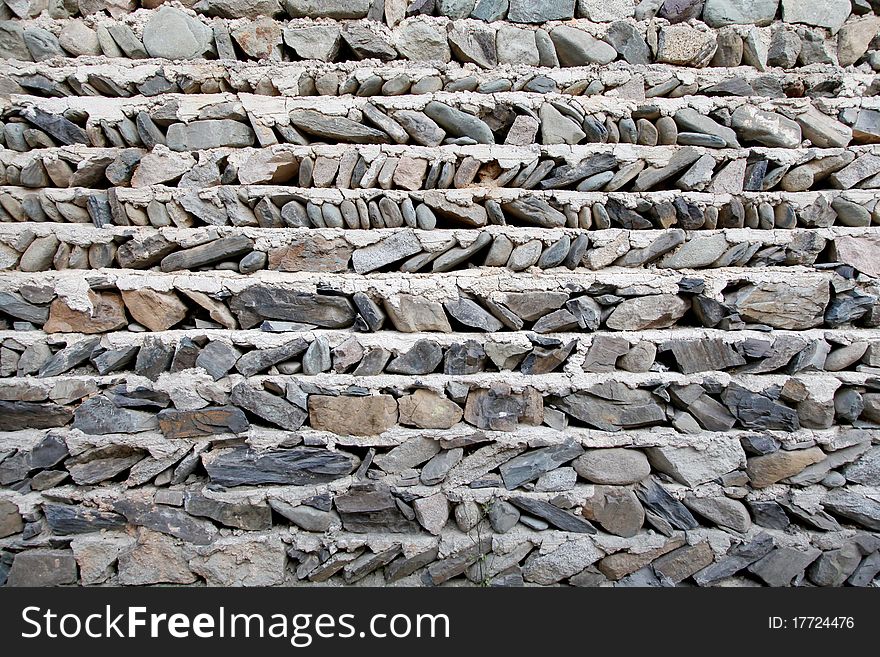 Hard rock wall, mountain village house wall.