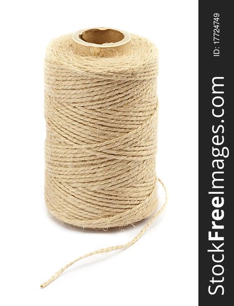 A spool of rope twine on white background