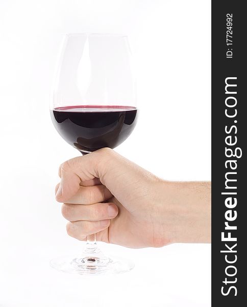 Hand holding glass of red whine. Studio shot. White background. Hand holding glass of red whine. Studio shot. White background.