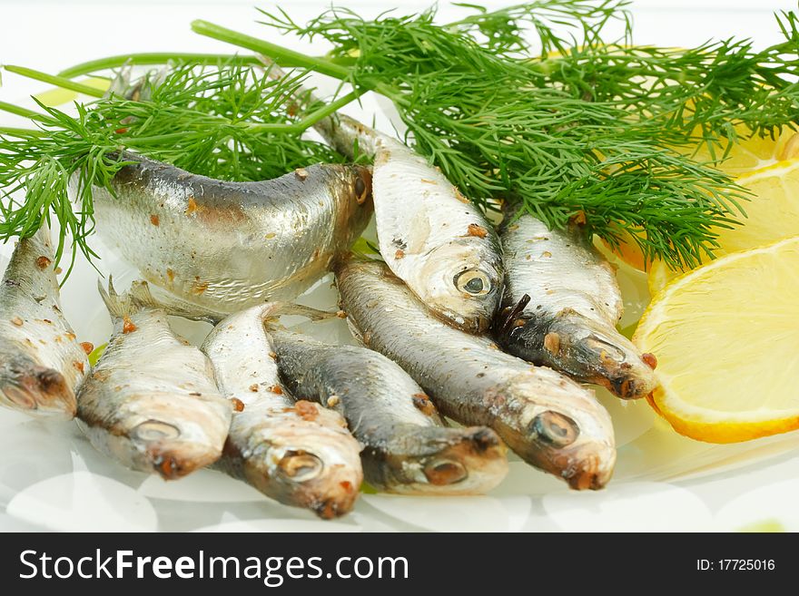 Salted sprats with lemon and dill