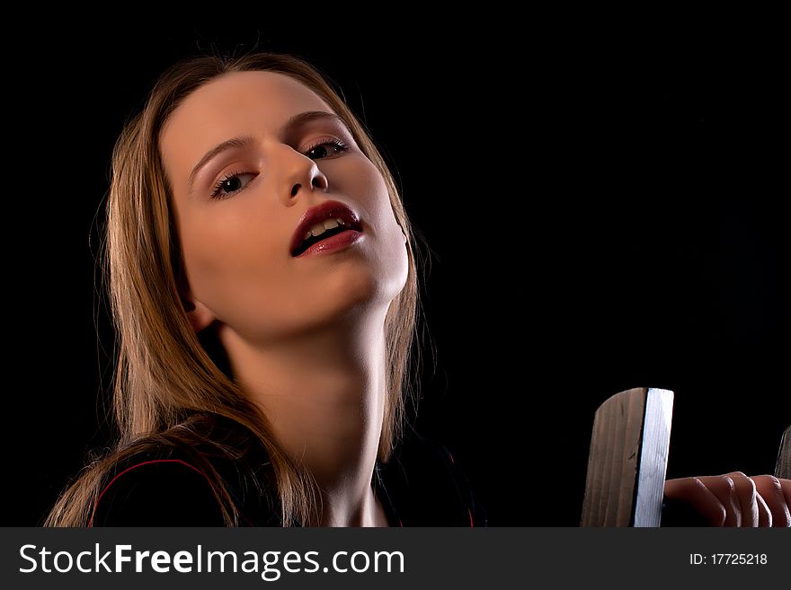 Seductive young girl sitting in chair with mouth slightly opened. Seductive young girl sitting in chair with mouth slightly opened